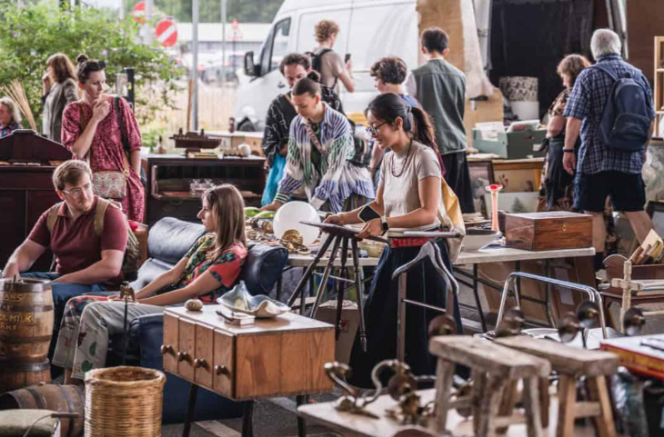 The best things to do in London this weekend: people looking at furniture at a flea maerket