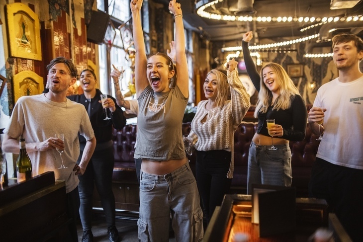 People having fun playing darts