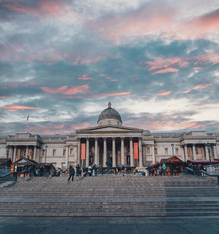 The National Gallery in London with a stunning sunset sky, showcasing its classic architecture.. Image: <a href=
