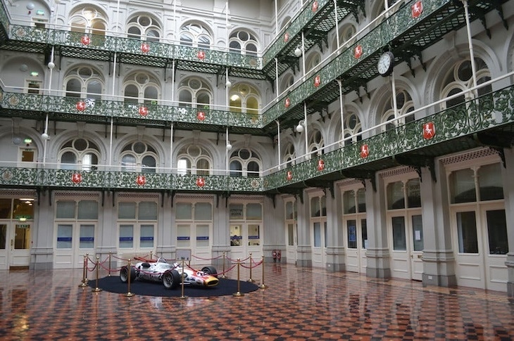 Inside the southwark hop exchange, with a formula 1 car parked within
