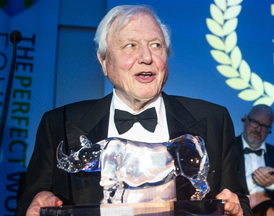 David Attenborough's London: Sir David Attenborough holding a crystal rhinoceros trophy at The Perfect World Foundation Award ceremony in 2018.