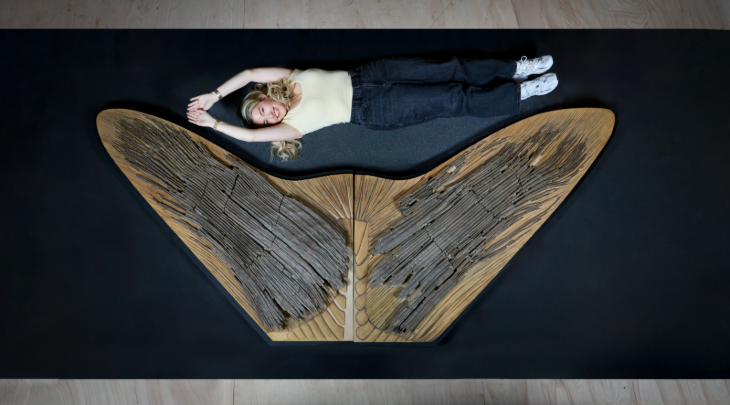 Things to do in London in May half term: a woman lying down next to the tail of a Leedsichthys, which is as big as her