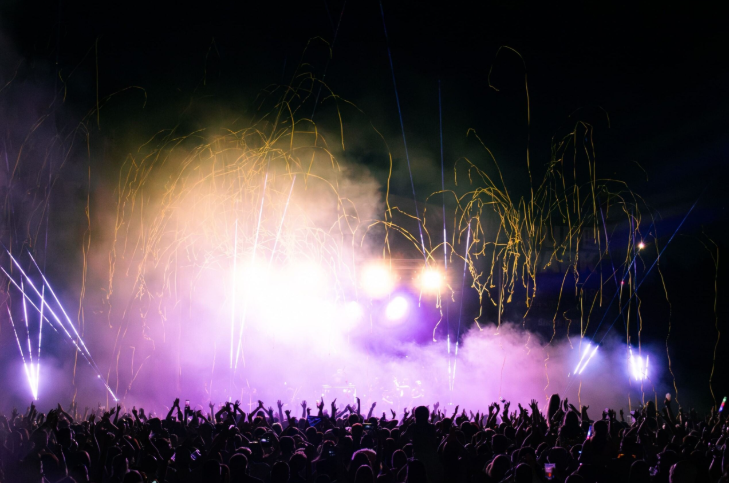 What's on in London this weekend: a festival crowd, with fireworks or pyrotechnics in the background