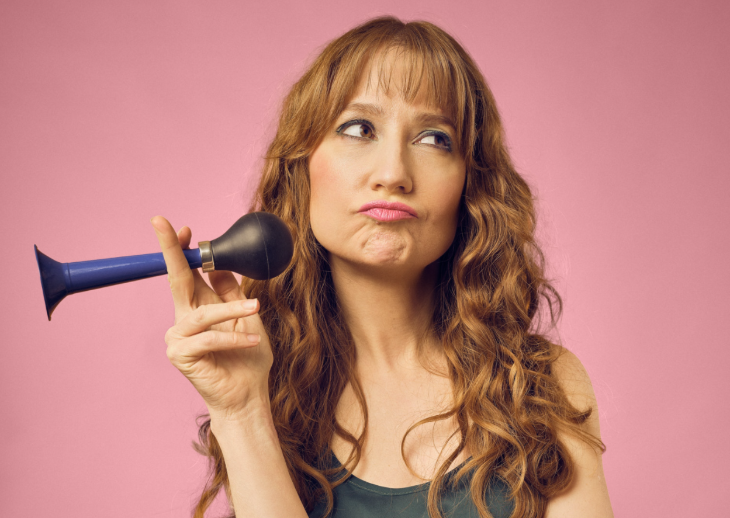 Top events in London this weekend:  Susan Harrison with a pensive expression on her face, holding an old-fashioned bike horn