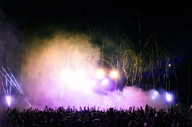 Top things to do in London in May 2026: a huge festival crowd in front of a stage illuminated with pyrotechnics