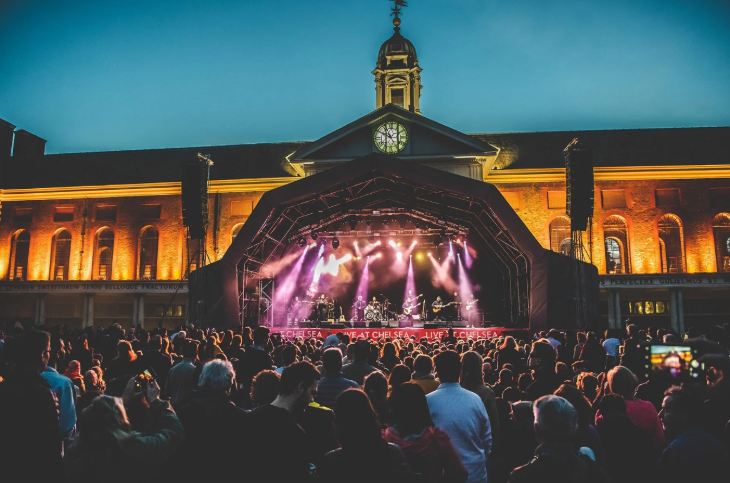 What's on in London in June 2026: open-air crowds watching a gig on a stage in front of the Royal Hospital Chelsea at dusk