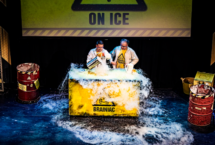 Best family/children's theatre shows in London for summer 2026: two adults surrounded by smoke on stage in Brainiac Live