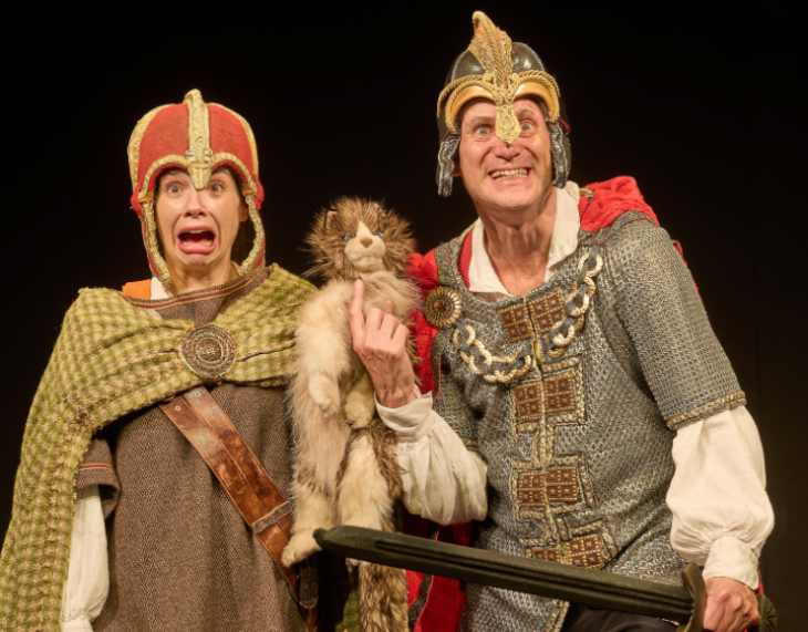 Best family/children's theatre shows in London for summer 2026: two people in period dress with a stuffed cat in Horrible Histories