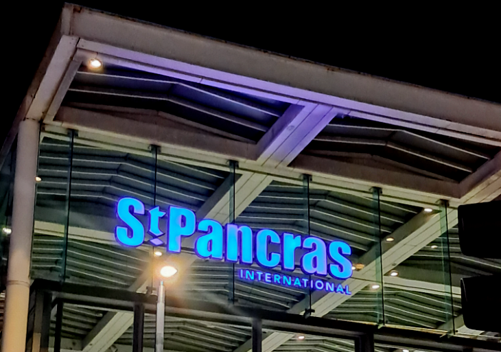 Extreme day trip from London to Lille: the St Pancras International sign, illuminated in the early morning darkness