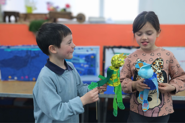 Things to do in London in the summer holidays 2026: two children playing with puppets they've made