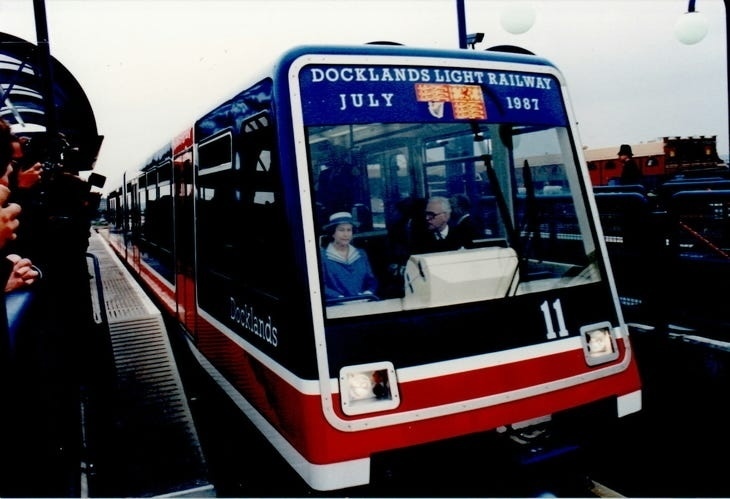 Queen Elizabeth II opening the Docklands Light Railway, pretending to drive