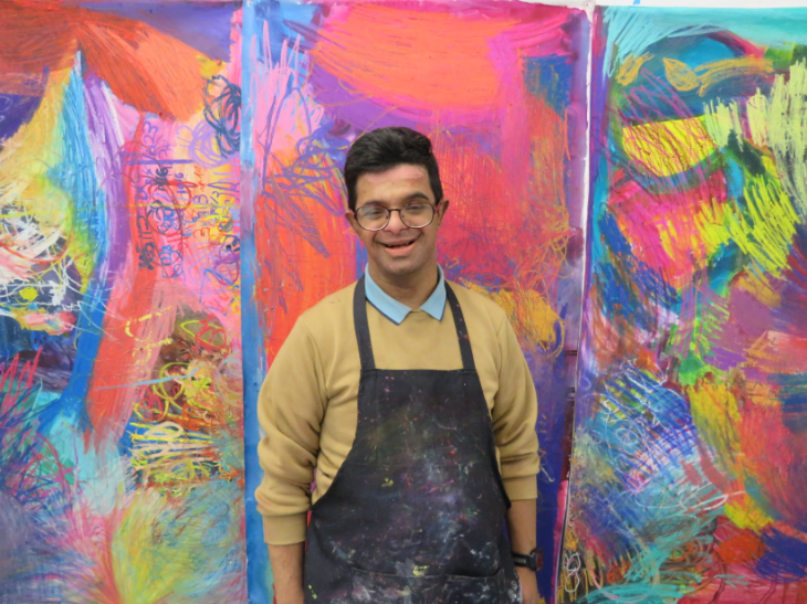 Things to do in London in July 2026: an artist standing in front of a brightly coloured wall