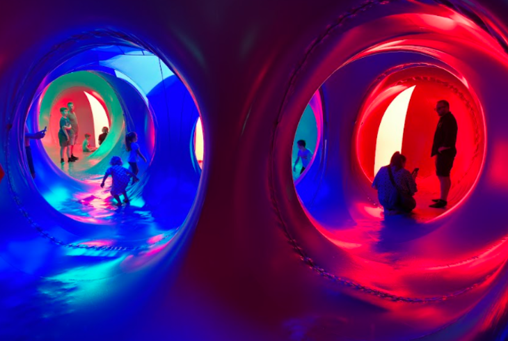 Top bank holiday weekend events London: people exploring giant colourful tunnels