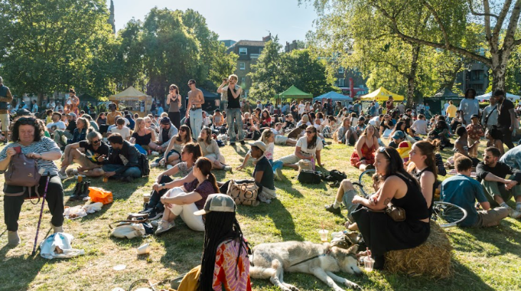 Top events in London this weekend: people sitting on grass eating and drinking at a food festival