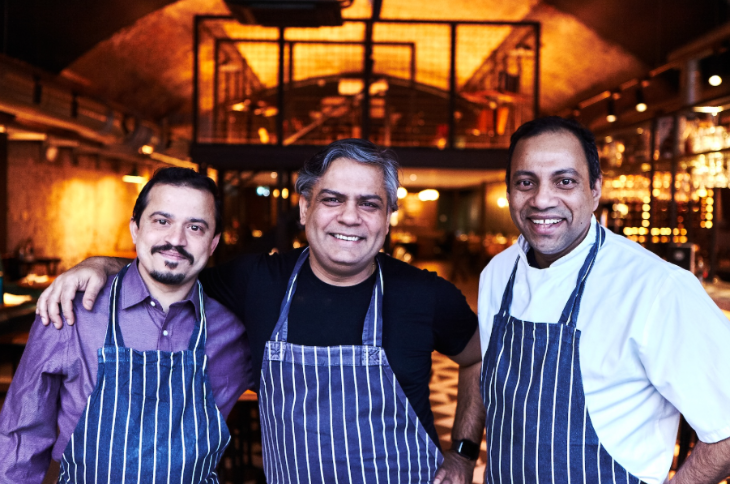 What's on in London this weekend: three chefs in matching aprons posing for a photo in a restaurant