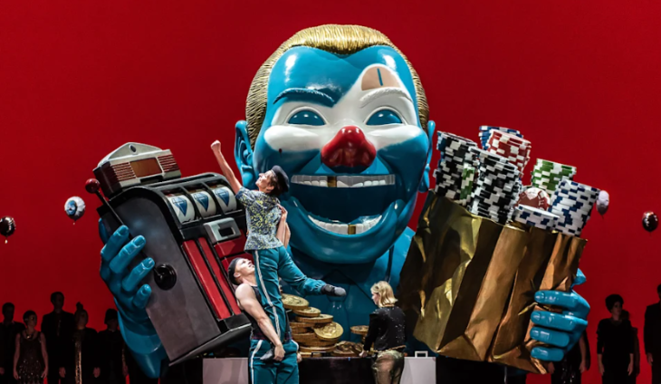 Things to do today in London: dancers performing in front of a large blue clown face