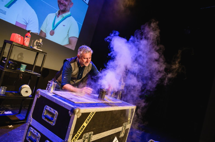 Things to do in London today: a man performing a science experiment involving smoke