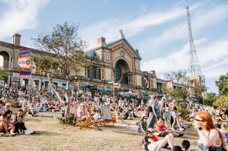 Top bank holiday weekend events London: people sitting on the hill in front of Alexandra Palace in the sunshine