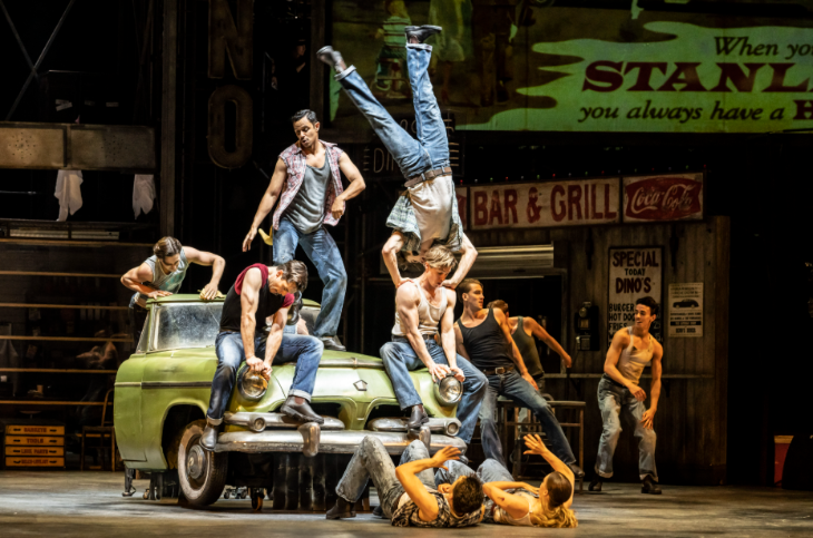 Things to do in London in July 2026: the cast of Car Man posing on a car on stage