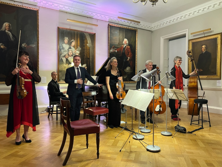 What's on in London this weekend: an orchestra performing in a grand room with large portraits on the walls