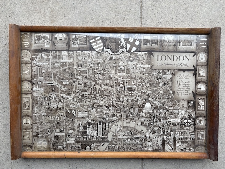 A wooden tree made from wood from Old Waterloo Bridge with a map by kerry lee of london on the top