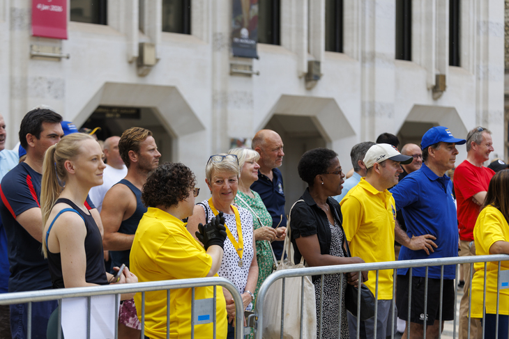 Spectators behind a barrier