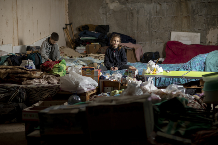 Photograph of children taking shelter to escape Russian air strikes in Kharkiv, Ukraine 2022.