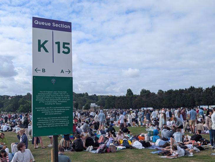 The queue, with a queue section sign in front of it