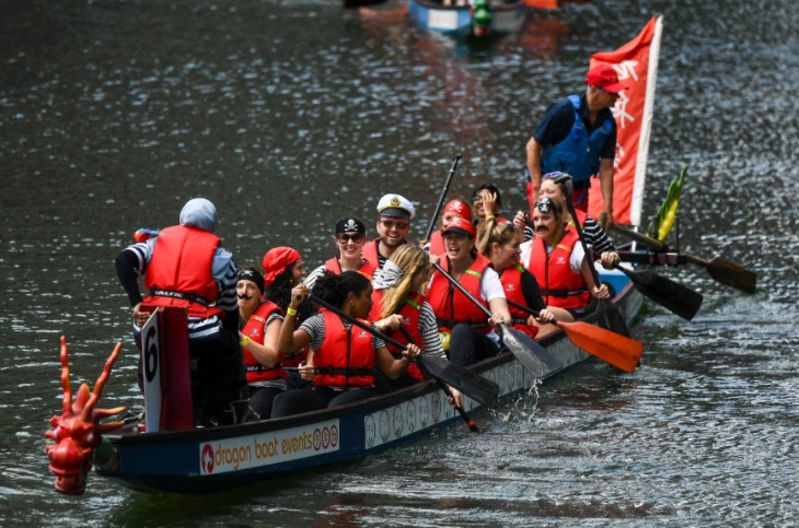 Things to do in London today: a dragon boat team wearing red life jackets on board their vessel