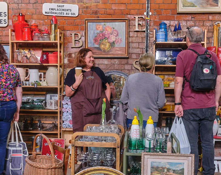 People browsing a stall at a flea market