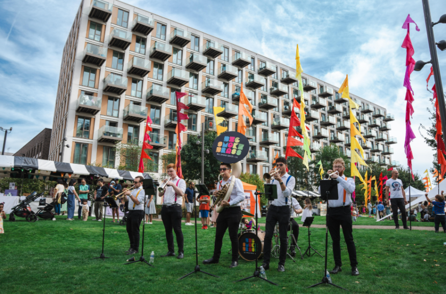 Free events in London this week: a band performing on grass beneath colourful bunting at a fete