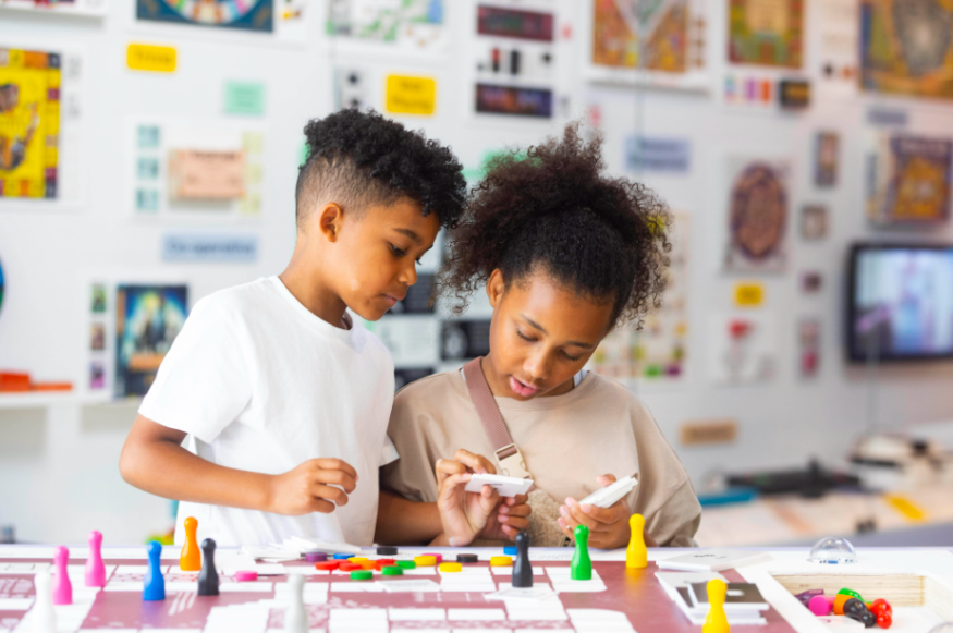Free things to do in London in the 2026 summer holidays: two children poring over a board game