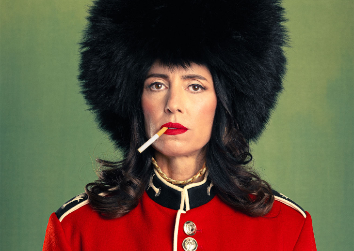  Top events in London today:  a woman wearing a black bearkskin hat, with a cigarette in her mouth