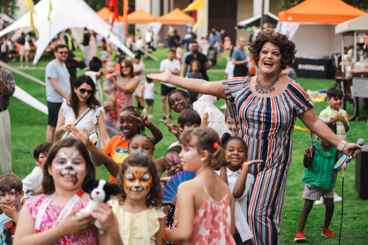 Things to do in London today: children, some with faces painted, dancing and playing outside