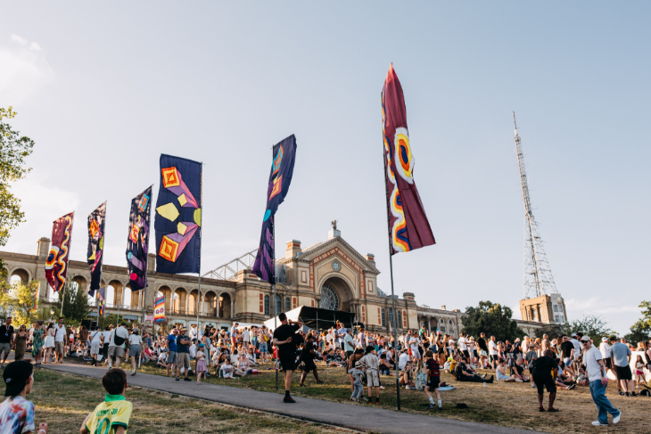 What's on in London this weekend: people sitting on the hillside in front of Alexandra Palace