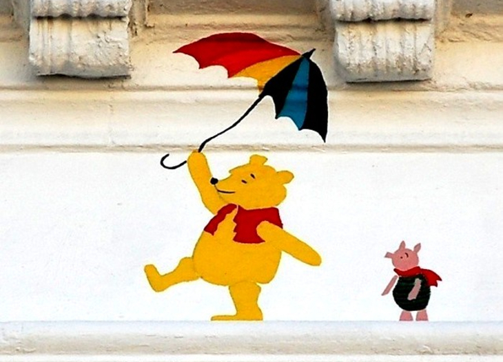 A painting of Winnie the Pooh holding an umbrella, and Piglet