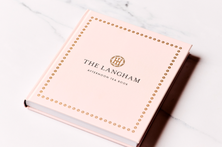 The pastel pink cover of the Langham's afternoon tea book