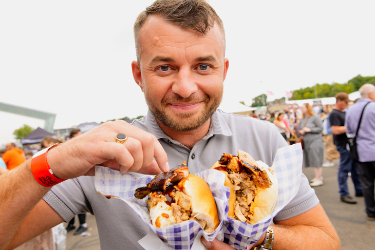 A man tucking into tasty wraps