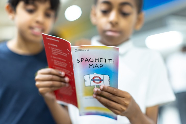 Two children reading the map