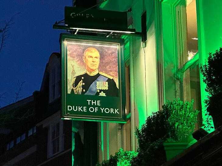 A hanging sign featuring the former Duke of York, Andrew Mountbatten Windsor