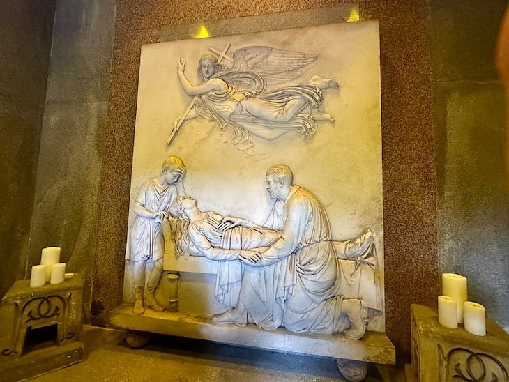 A marble bas relief of a lady dying 