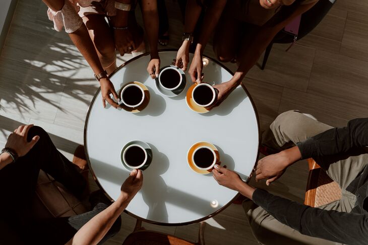 A table of black coffees from above
