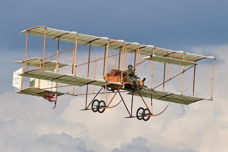 A biplane in the clouds