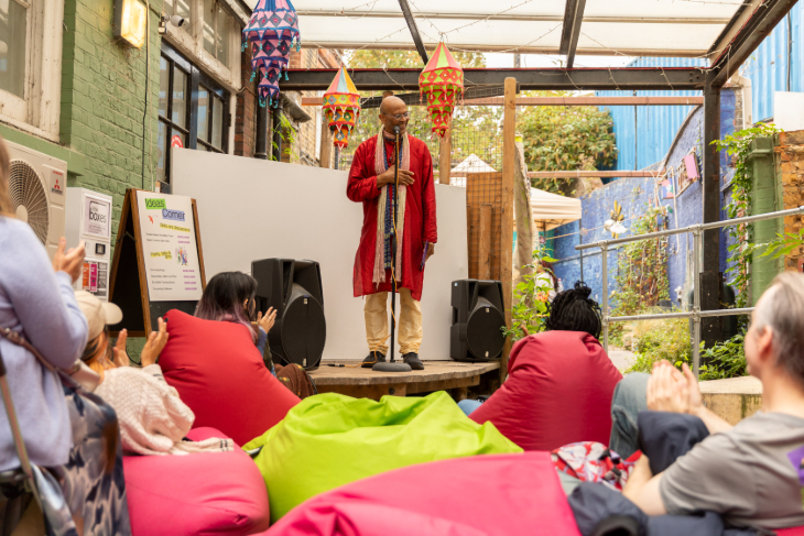 September 2026 top events in London: a person in colourful robes on a small stage, watched by people lounging on bean bags