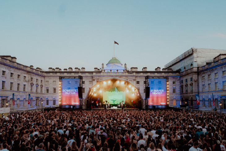 Things to do in London today: huge crowds watching a performance on a temporary stage in the courtyard at Somerset House