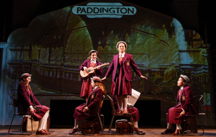 Today's events in London: cast members in maroon school uniform, on stage in Malory Towers