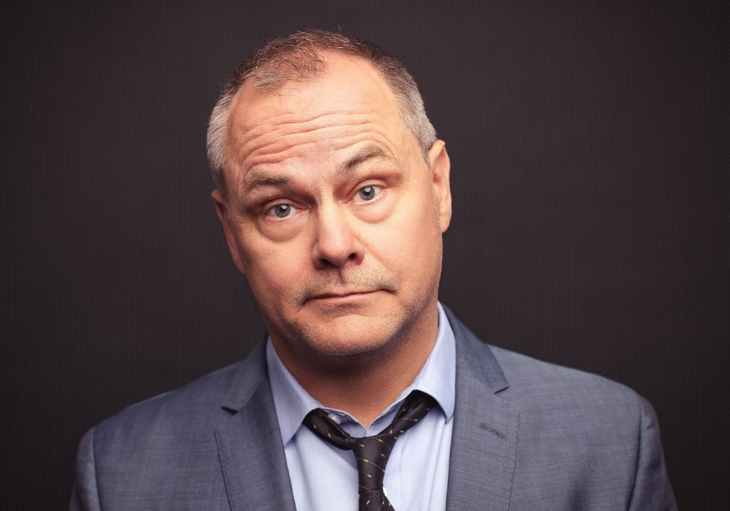 Jack Dee, looking straight at the camera