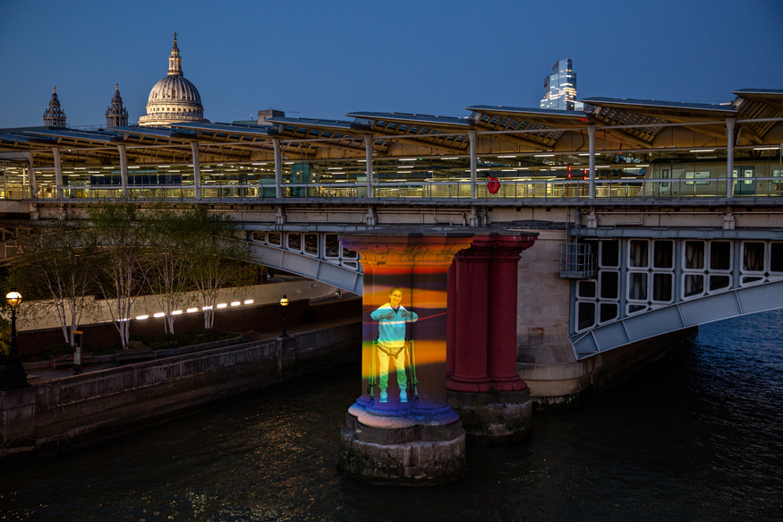 A colourful projection on a bridge pillar