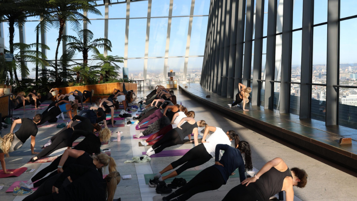 People taking part in a yoga or pilates session in the Sky Garden