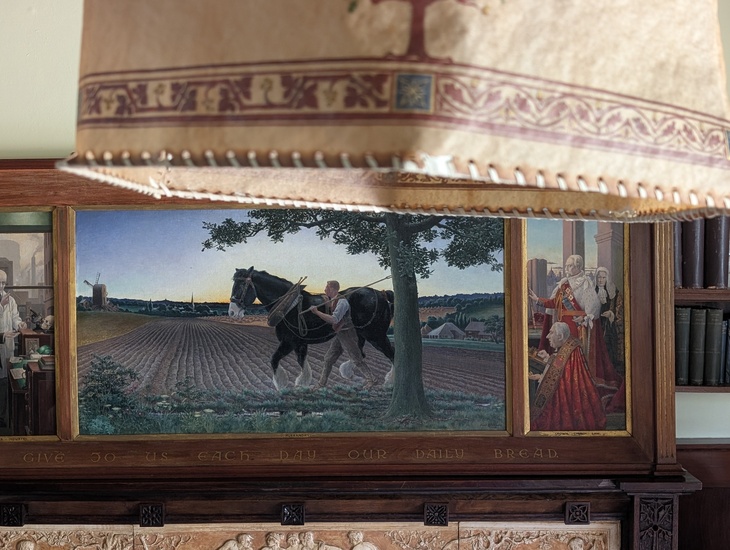 A close-up of a painting of a farmer ploughing the fields